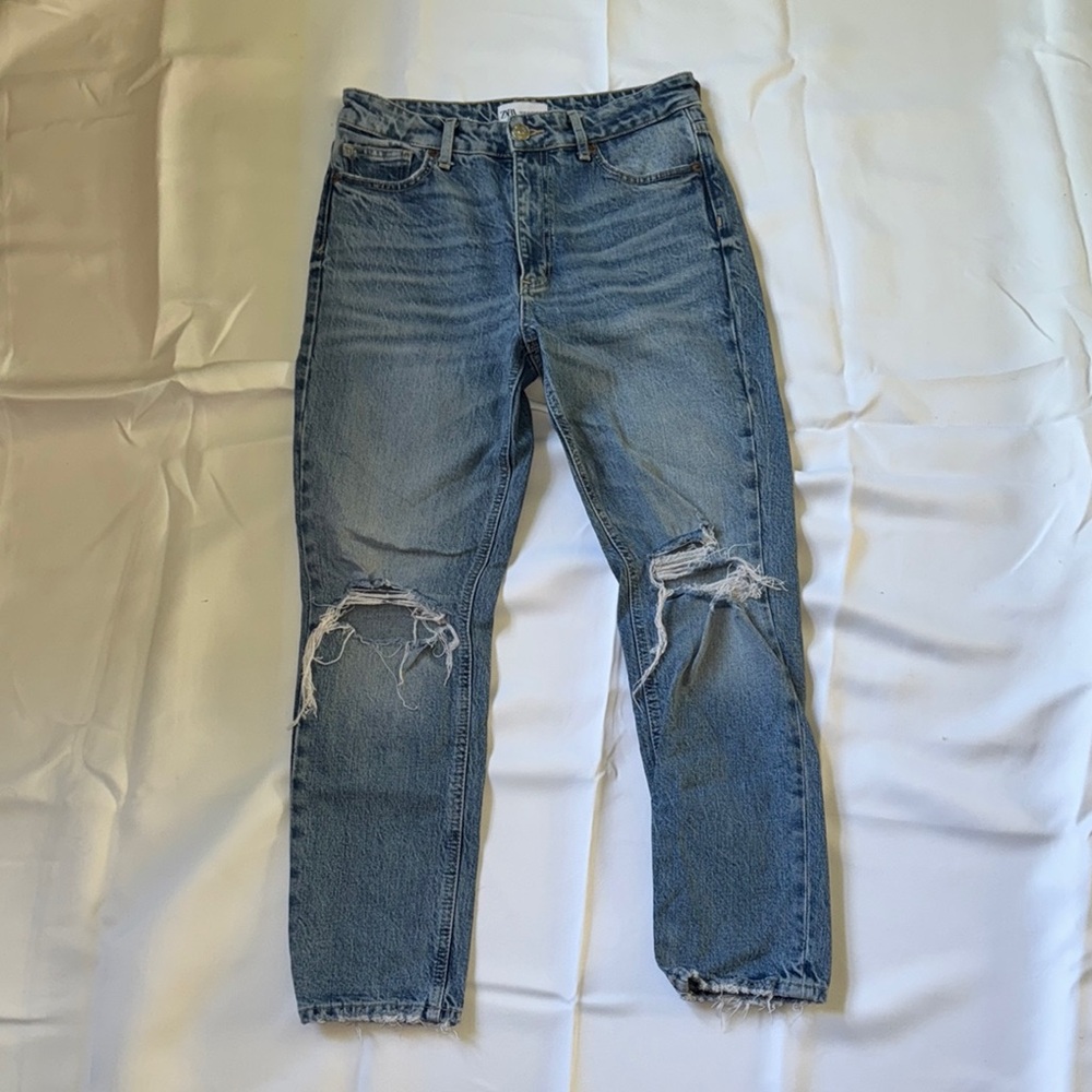 Woman’s Blue Distressed Jeans
